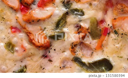 Enjoy a delicious and cheesy chicken veggie bake that includes colorful peppers and more 131580394