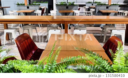Stylish Outdoor Dining Space Featuring Modern Furnishings for an Inviting Atmosphere Stylish Outdoor Dining Space Featuring Modern Furnishings for an Inviting Atmosphere 131580410