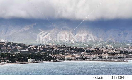 Experience the Stunning Coastal View Accompanied by a Dramatic Mountain Backdrop and Inspiration Experience the Stunning Coastal View Accompanied by a Dramatic Mountain Backdrop and Inspiration 131580499