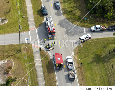 Car hit cyclist accident on city street in Florida. Result of distracted driving and speeding. Emergency paramedics at vehicle and bike crash in USA Car hit cyclist accident on city street in Florida. Result of distracted driving and speeding. Emergency paramedics at vehicle and bike crash in USA 131582176