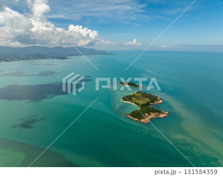 Scenic view of isolated tropical islands surrounded by turquoise waters and lush greenery. Bo Put. Koh Samui, Thailand. Scenic view of isolated tropical islands surrounded by turquoise waters and lush greenery. Bo Put. Koh Samui, Thailand. 131584359