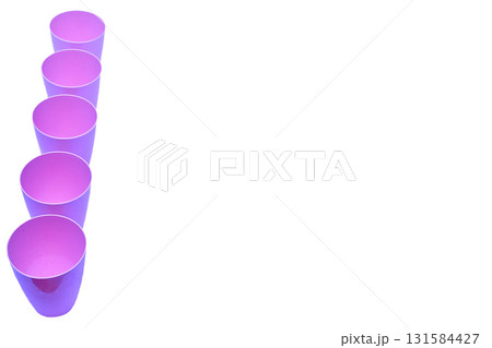 Five pink purple plastic cups for drink isolated on white Five pink purple plastic cups for drink isolated on white 131584427