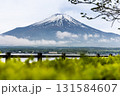 Scenic view of Mount Fuji over lake kawaguchiko during springtime with lush foliage 131584607
