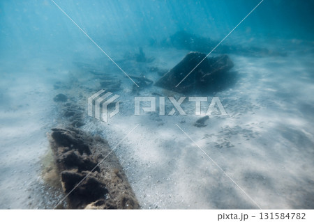 Underwater sea with wreck ship on sandy sea bottom in ocean Underwater sea with wreck ship on sandy sea bottom in ocean 131584782
