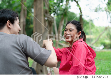 Friendship and Healthy Living. Two friends celebrating their active lifestyle with a moment of camaraderie. Friendship and Healthy Living. Two friends celebrating their active lifestyle with a moment of camaraderie. 131585793