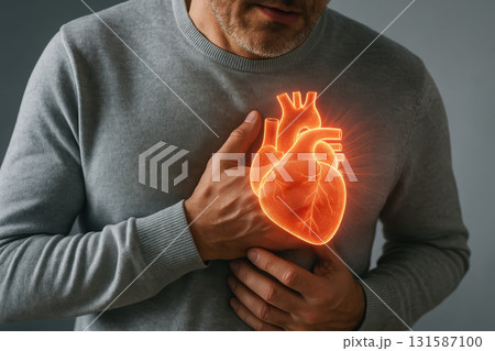 Man holding chest with glowing heart illustration showing medical concern, heart pain, cardiovascular disease, health risk, and urgent need for medical attention, emotional expression of discomfort Man holding chest with glowing heart illustration showing medical concern, heart pain, cardiovascular disease, health risk, and urgent need for medical attention, emotional expression of discomfort 131587100