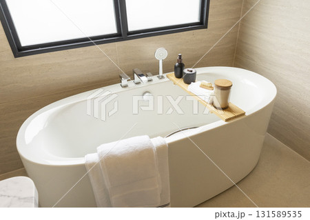 white freestanding tub in new luxury home bathroom. 131589535
