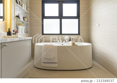 white freestanding tub in new luxury home bathroom. 131589537