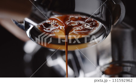 pull espresso shot with bottomless portafilter on a professional coffee machine pull espresso shot with bottomless portafilter on a professional coffee machine 131592962