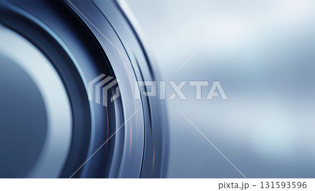 Curved, metallic surface reflecting modern design elements under soft lighting. 131593596