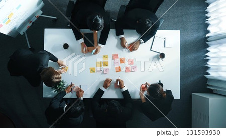 Top view of business people writing marketing idea on sticky note. Directorate. Top view of business people writing marketing idea on sticky note. Directorate. 131593930