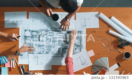 Top view of team talking about plan while manager walking at table. Symposium. Top view of team talking about plan while manager walking at table. Symposium. 131593963