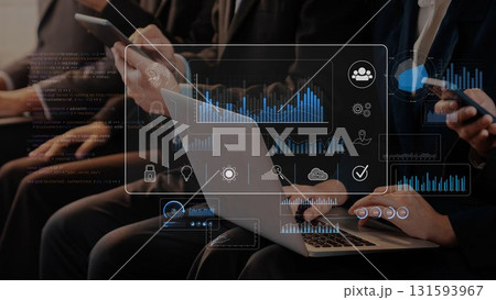 Data Analytics and Business Technology Discussion in Office Meeting with Multiple Devices and Graphical Interfaces Representing Digital Insights. Raster 131593967