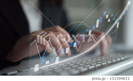 Professional hands typing on keyboard with dynamic finance chart showcasing stock market trends and data analysis in modern office environment Copula 131594651