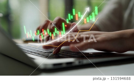 Hands Typing on Laptop with Stock Market Graph Overlay Showing Financial Growth and Trends in a Modern Office Environment Copula Hands Typing on Laptop with Stock Market Graph Overlay Showing Financial Growth and Trends in a Modern Office Environment Copula 131594688