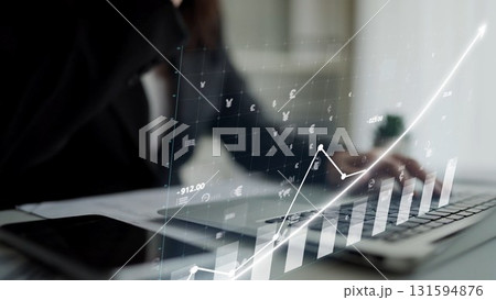 Professional workspace with financial graphs and data analysis displayed on a laptop showing trends and growth in digital technology and finance sectors Copula 131594876