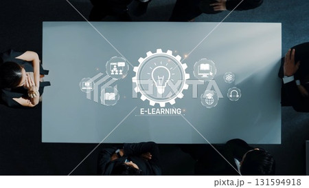 Business Meeting on E-Learning Concept with Digital Icons Representing Online Education and Technology Solutions in Modern Workspace. Raster Business Meeting on E-Learning Concept with Digital Icons Representing Online Education and Technology Solutions in Modern Workspace. Raster 131594918
