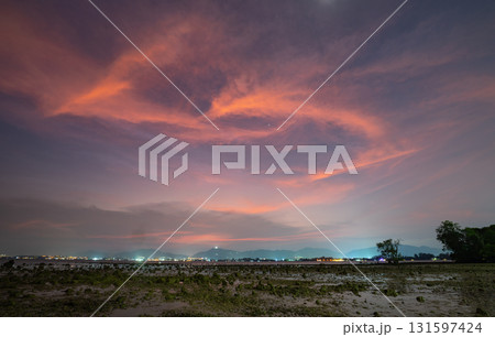 aerial view amazing pink clouds in sunset above the ocean. 131597424
