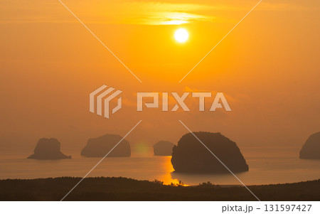 beautiful yellow sunrise at Samet Nangshe landmark of Phang Nga Thailand. beautiful yellow sunrise at Samet Nangshe landmark of Phang Nga Thailand. 131597427