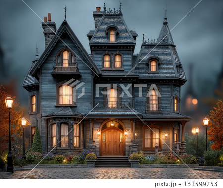 Victorian style house with warm glowing windows at dusk Victorian style house with warm glowing windows at dusk 131599253