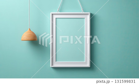 White frame hanging on blue wall with wooden pendant lamp 131599831