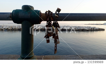 Love locks on a balustrade on the Naples waterfront. 131599989