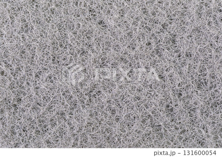 Macro view of texture surface of black kitchen scrubber sponge layer. Macro view of texture surface of black kitchen scrubber sponge layer. 131600054