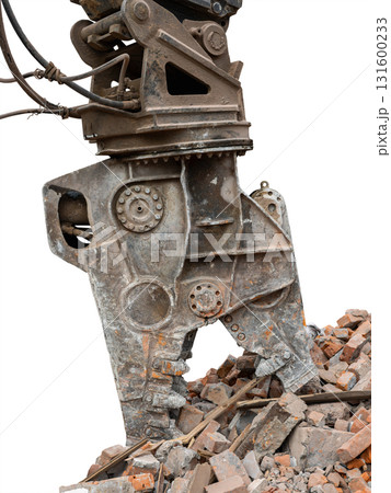 Heavy machinery removes debris during construction in an isolated environment with clear skies visible above Heavy machinery removes debris during construction in an isolated environment with clear skies visible above 131600233
