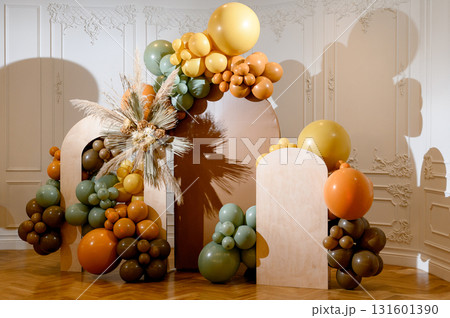 Modern brown and green balloon party decor 131601390