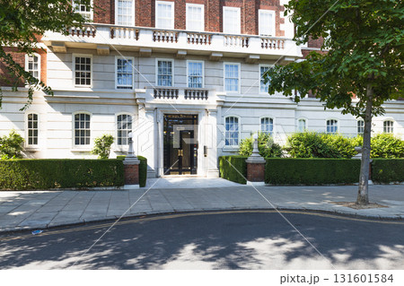 Elegant London Residential Building Facade with Classic Architecture and Greenery 131601584