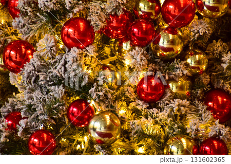 Close-up of the Christmas trees with colorful ornaments. Festive decoration. Full of ornaments. Winter season, winter festive. Christmas celebration, Xmas celebration. For background use. Close-up of the Christmas trees with colorful ornaments. Festive decoration. Full of ornaments. Winter season, winter festive. Christmas celebration, Xmas celebration. For background use. 131602365