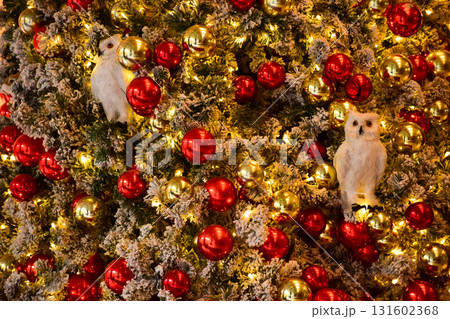 Close-up of the Christmas trees with colorful ornaments. Festive decoration. Full of ornaments. Winter season, winter festive. Christmas celebration, Xmas celebration. For background use. Close-up of the Christmas trees with colorful ornaments. Festive decoration. Full of ornaments. Winter season, winter festive. Christmas celebration, Xmas celebration. For background use. 131602368