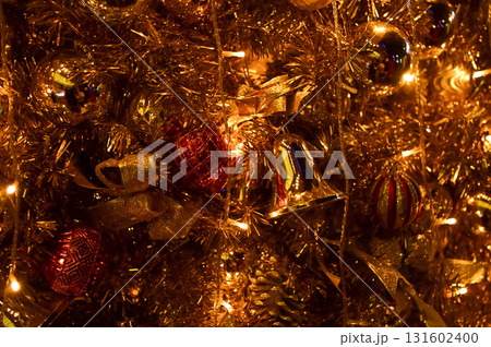 Close-up of the Christmas trees with colorful ornaments. Festive decoration. Full of ornaments. Winter season, winter festive. Christmas celebration, Xmas celebration. For background use. 131602400