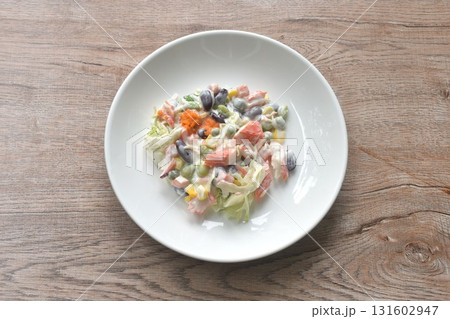 imitation crab stick with corn and garden pea couple cabbage vegetable topping shrimp egg salad dressing cream sauce on plate imitation crab stick with corn and garden pea couple cabbage vegetable topping shrimp egg salad dressing cream sauce on plate 131602947