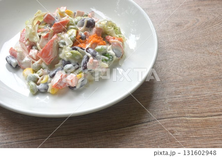 imitation crab stick with corn and garden pea couple cabbage vegetable topping shrimp egg salad dressing cream sauce on plate imitation crab stick with corn and garden pea couple cabbage vegetable topping shrimp egg salad dressing cream sauce on plate 131602948