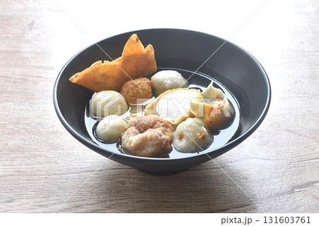 boiled Hakka meatball made fish and shrimp with bean sprout topping crispy dumpling in clear soup on bowl boiled Hakka meatball made fish and shrimp with bean sprout topping crispy dumpling in clear soup on bowl 131603761