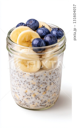 Healthy breakfast visual with chia, oats, and berries in a clear jar on white minimalist background. 131604057