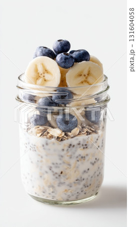 Isolated glass jar of overnight oats with fruit, ideal for clean eating and wellness-themed content. Isolated glass jar of overnight oats with fruit, ideal for clean eating and wellness-themed content. 131604058