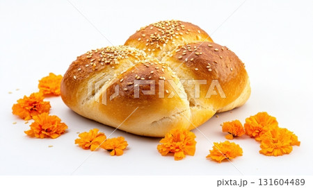 Pan de muerto on white, a cultural culinary symbol of remembrance for Mexican holiday themes 131604489