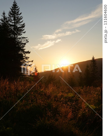 Beautiful mountain landscape, light over peaks and valleys, natural scenery, calm atmosphere and wild nature 131604600