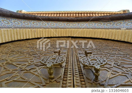 Brass doors adorned with Moroccan patterns, metal filigree, and intricate relief work. Royal Palace, Fez, Morocco 131604603