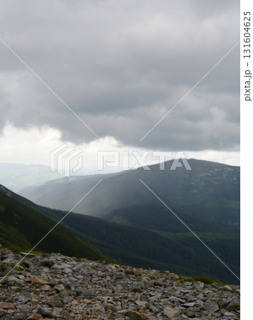Beautiful mountain landscape, light over peaks and valleys, natural scenery, calm atmosphere and wild nature Beautiful mountain landscape, light over peaks and valleys, natural scenery, calm atmosphere and wild nature 131604625