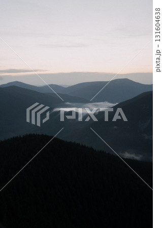 Beautiful mountain landscape, light over peaks and valleys, natural scenery, calm atmosphere and wild nature 131604638