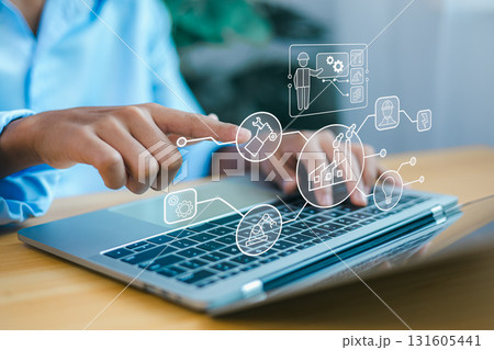 Industrial automation technology concept with engineer using laptop to control smart factory system Industrial automation technology concept with engineer using laptop to control smart factory system 131605441