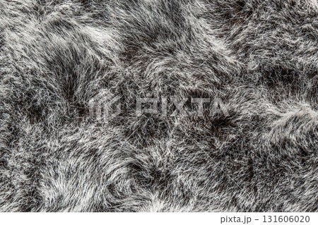 artificial fur texture with soft, wavy fibers in shades black and gray ideal for design projects. artificial fur texture with soft, wavy fibers in shades black and gray ideal for design projects. 131606020
