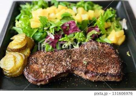 Healthy steak and salad meal on table at home Healthy steak and salad meal on table at home 131606976