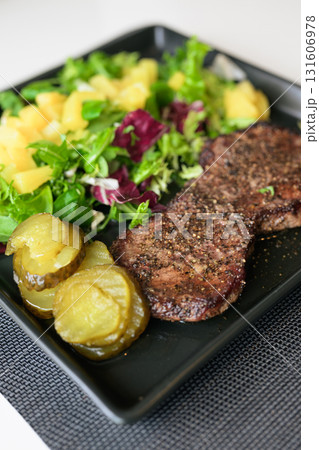 Healthy steak and salad meal on table at home Healthy steak and salad meal on table at home 131606978