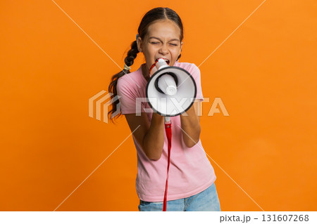 Child girl talking with megaphone proclaiming news loudly announcing advertisement discounts sale 131607268