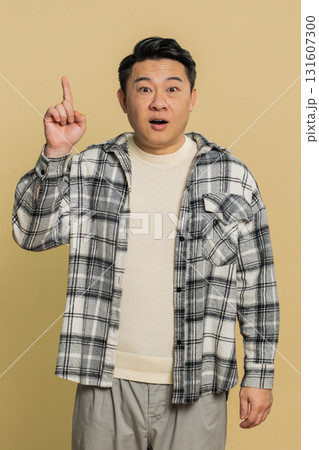 Inspired Asian man having good idea, plan, startup, showing inspiration motivation Eureka gesture Inspired Asian man having good idea, plan, startup, showing inspiration motivation Eureka gesture 131607300