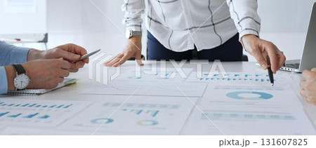 Business team analyzing financial charts during strategy meeting, professionals discussing data and performance metrics at workplace for decision making success Business team analyzing financial charts during strategy meeting, professionals discussing data and performance metrics at workplace for decision making success 131607825